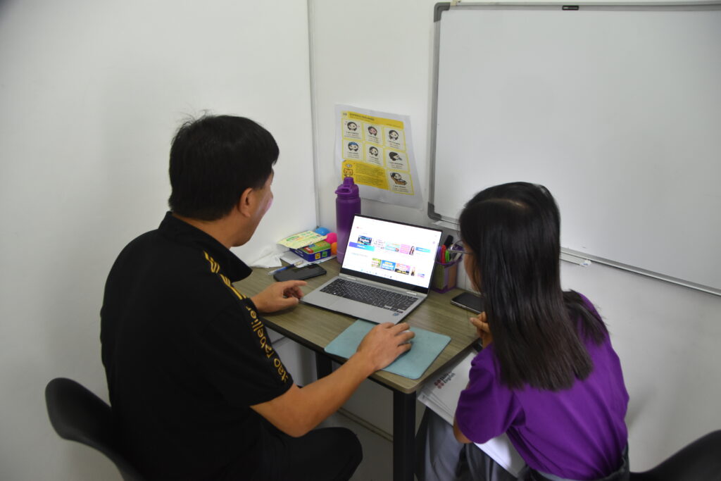 Teacher teaching an Intensive English Class on a Student