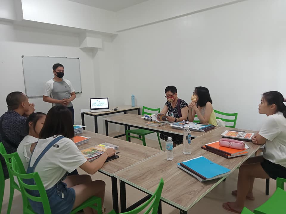 ESL teacher leading a class with diverse students General ESL course