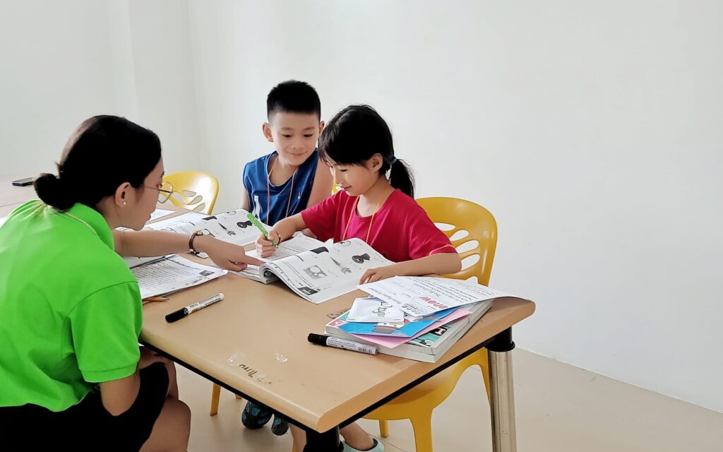 a teacher teaching her a junior small group class