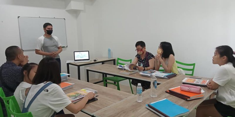 ESL teacher leading a class with diverse students General ESL course